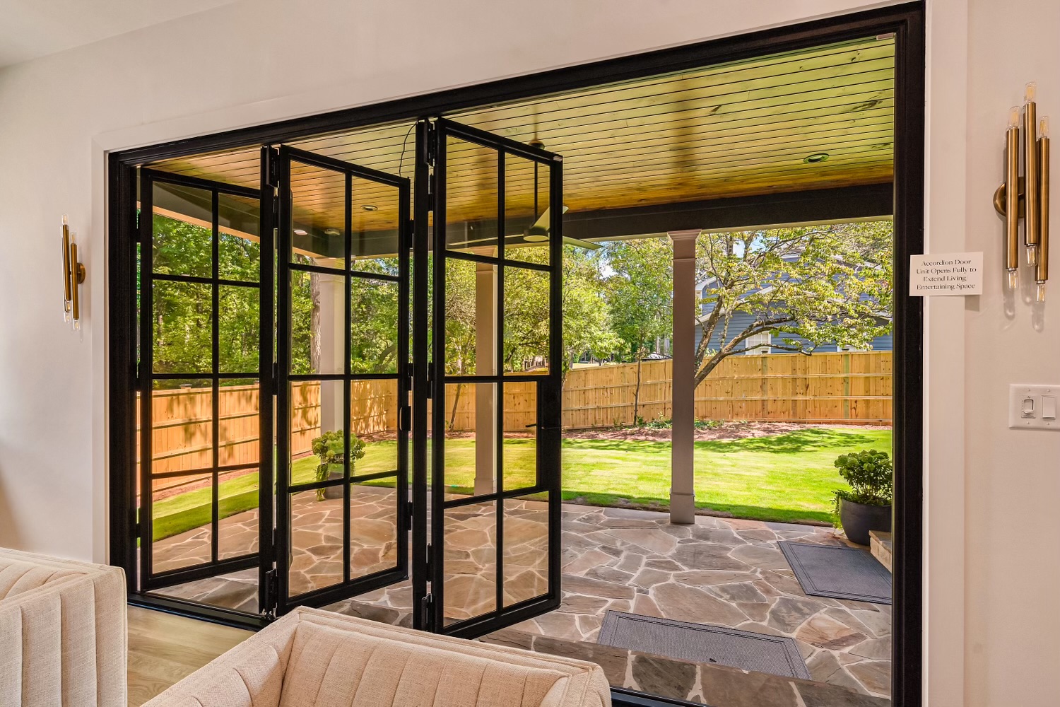 a patio with a glass accordion door